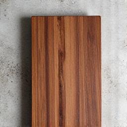 Thick wooden cutting board with a knife