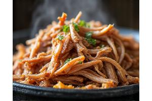 Pulled pork shoulder seasoned with mustard and black pepper